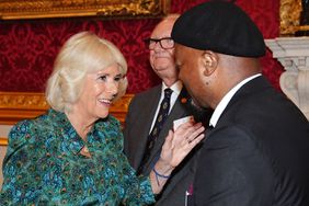 Queen Camilla, Patron of Book Aid International, greets Sir Ben Okri (right), during a reception to celebrate the 70th anniversary of Book Aid International, at St James's Palace on September 4, 2024