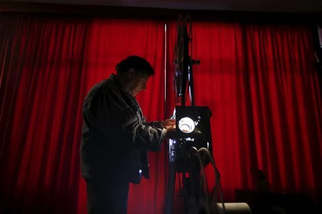 Projectionist Antonio Feliciano, 75, checks his projector before showing a film in Monforte, Portugal May 16, 2015. (Photo by Rafael Marchante/Reuters)