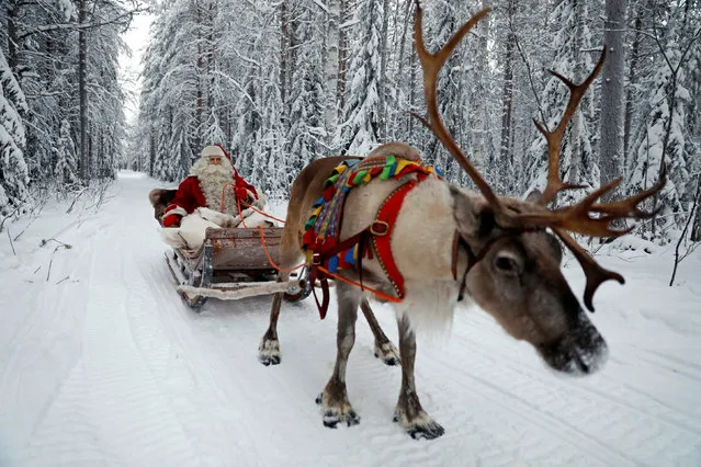 Santa Claus rides in his sleigh as he prepares for Christmas in the Arctic Circle near Rovaniemi, Finland December 15, 2016. (Photo by Pawel Kopczynski/Reuters)