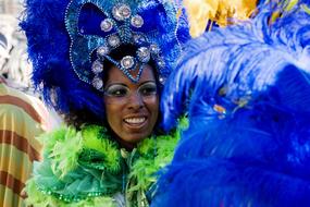 girl in costume with feathers at the carnival