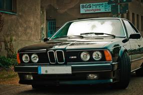 black retro Auto Bmw M6 parked on street