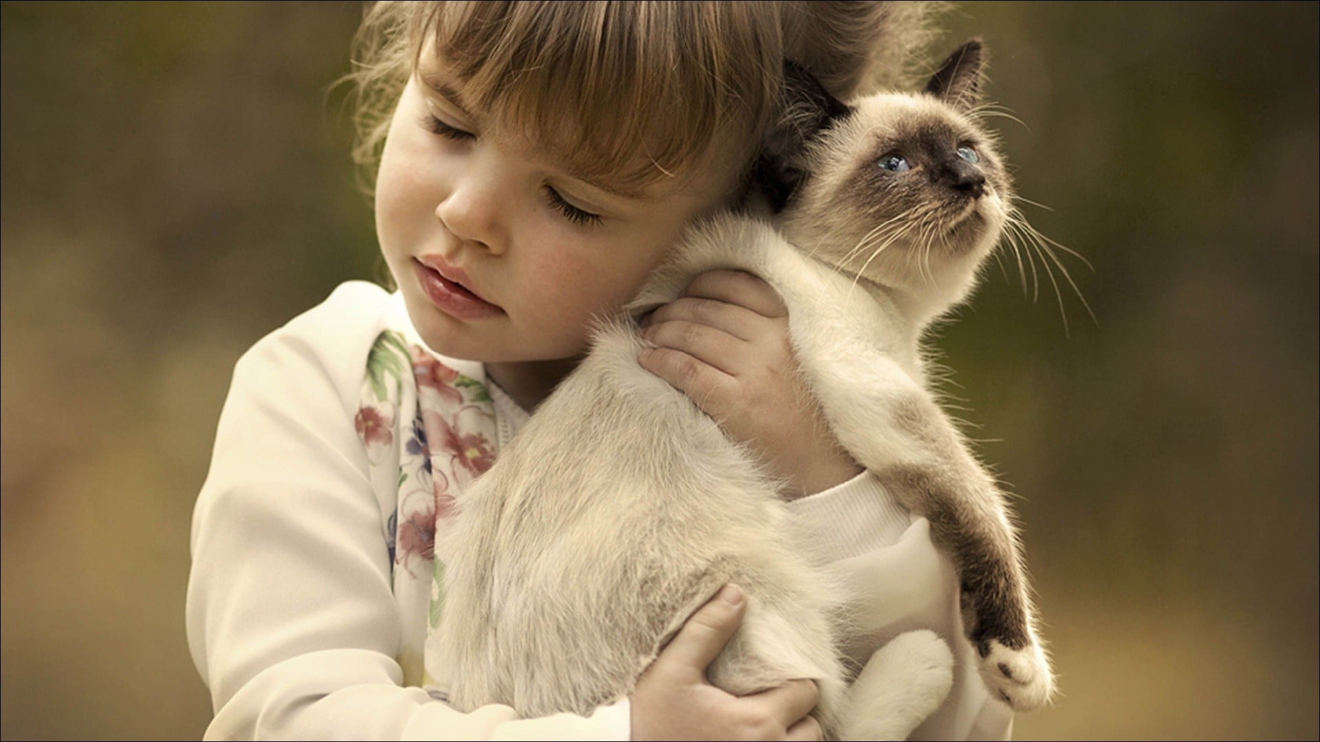 Girl holding cat