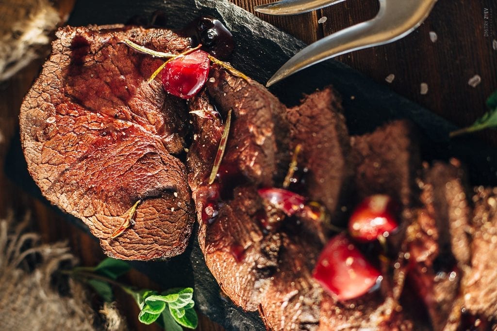 bear meat served on a long black plate