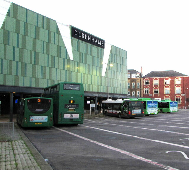 Three diesel buses and two electric buses in Friars Walk bus station, Newport