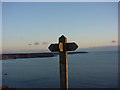 SM7607 : Marloes footpath sign and view of sea by dave challender