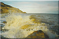 TQ8510 : Waves crashing on the Rocks at the foot of Fairlight Glen by Colin Smith