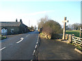 NY9369 : Roadside Cross on the B6318 Heavenfield. by Bill Henderson