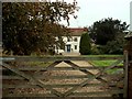 TM0537 : Farmhouse at Holton Place by Robert Edwards