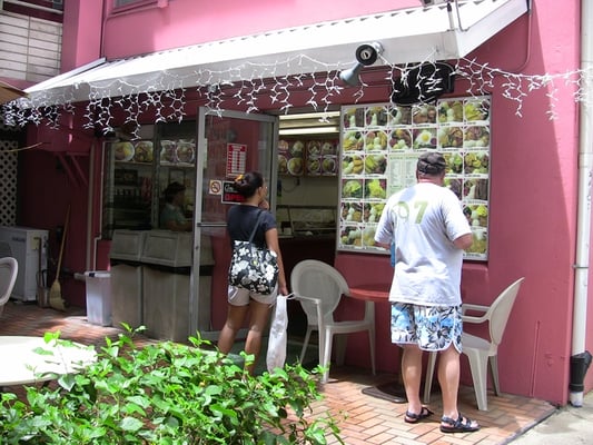 Photo of Me's BBQ - Honolulu, HI, US. studying the picture menu