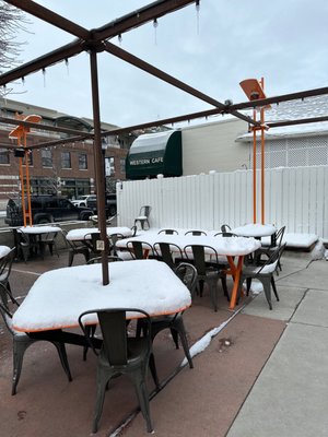 Photo of Western Cafe - Bozeman, MT, US. tables and chairs covered in snow