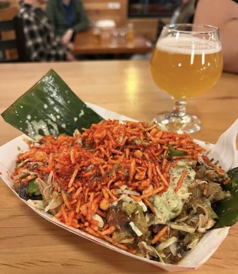 Photo of Kottu - Seattle, WA, US. a plate of food and a glass of beer