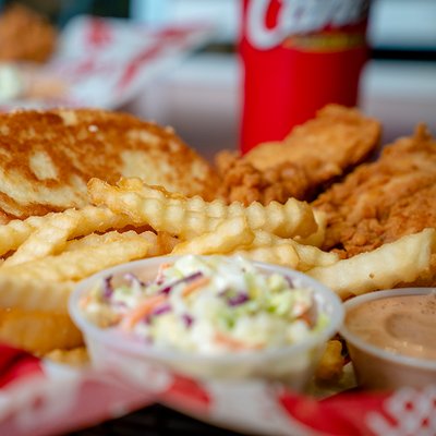 Photo of Raising Cane's Chicken Fingers - Houston, TX, US. a plate of fried food