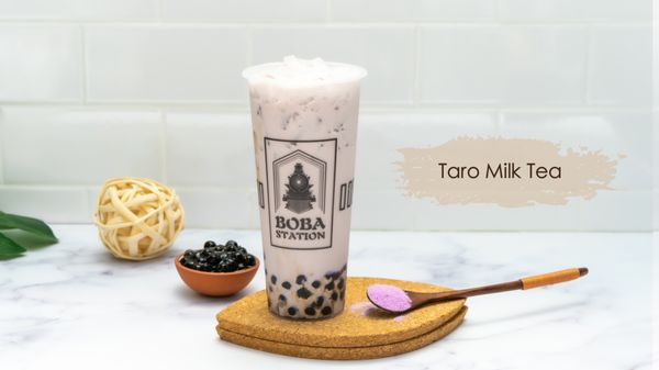 Photo of Boba Station - Riverside, CA, US. a glass of boba milk tea and a wooden spoon