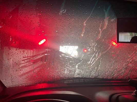 Photo of Chevron - Fremont, CA, US. a car's windshield with rain on it