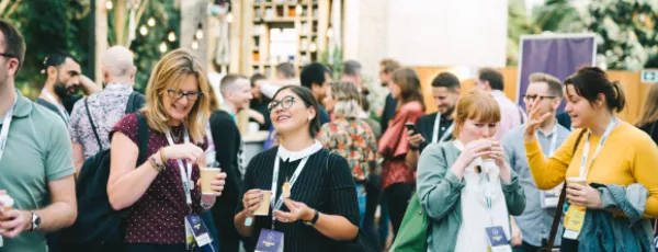 A photograph of a gathering of UX London attendees outside