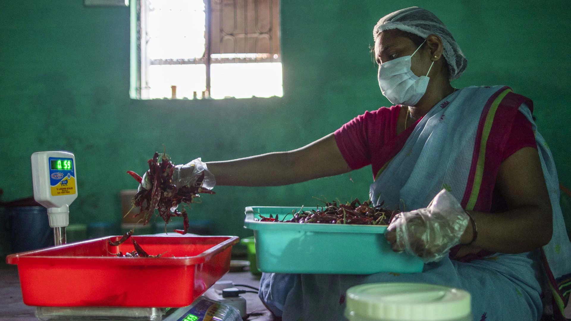 S. Sudha joined a self-help group in her village and the training she received led her to start a small business making and packaging spices for sale. Photo: JDot