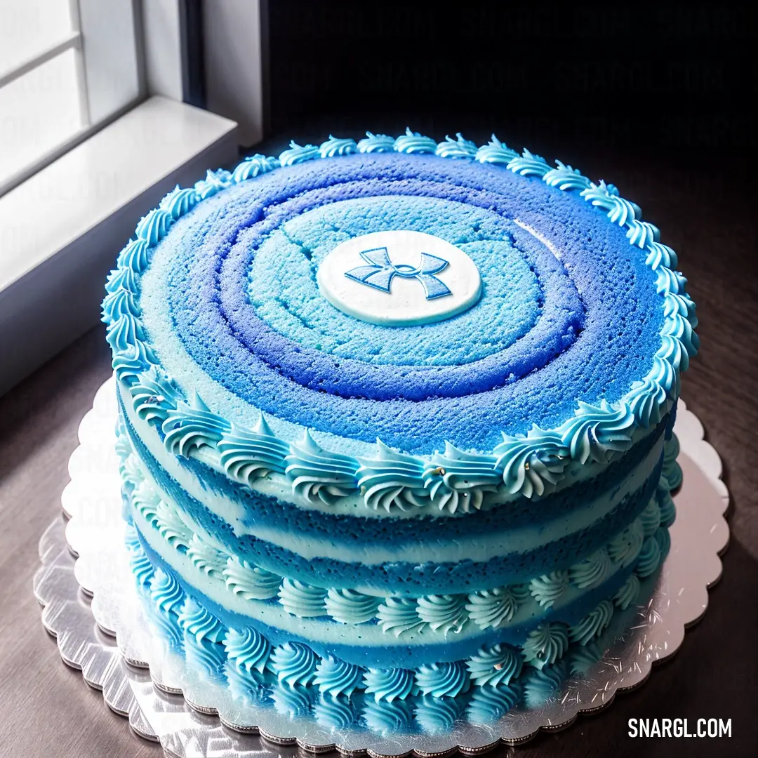 A beautifully decorated cake with blue frosting sits on a table, adorned with a star-shaped topper. Sunlight pours through a window, casting a warm glow on the delicate details.