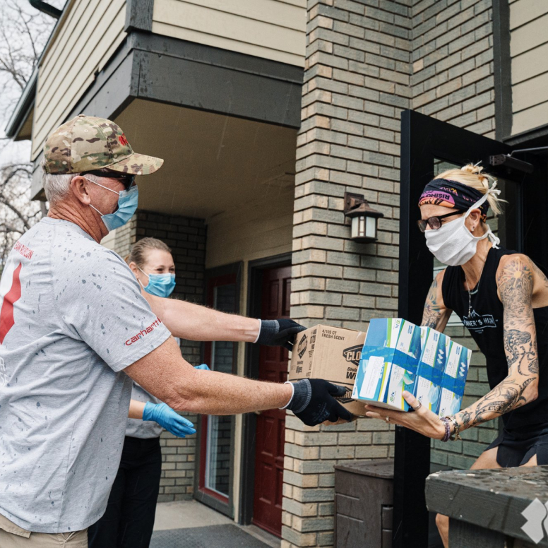 Team Rubicon volunteers handing out essential supplies.