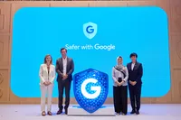 Four people standing and looking at the camera on stage. The background behind them reads "Safer with Google"