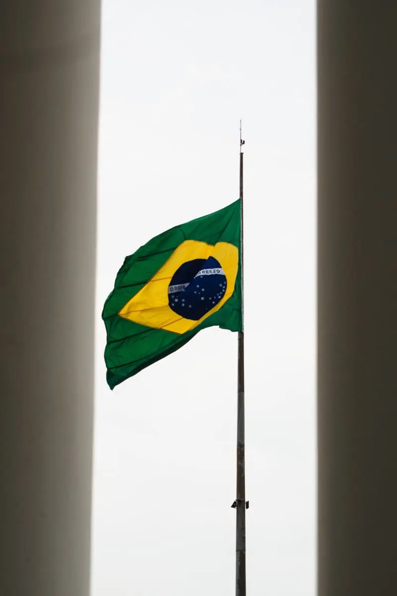 Brazilian flag on a pole.