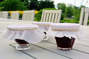 I've already started making jams from all the wonderful fruits we've harvested. This is strawberry - I am trying a new parchment paper for the cover. I love how they look in these vintage glass containers. Have you started picking some of your garden's summer berries? What have you done with them? Let me know in the comments below.