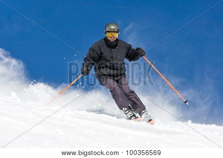 Skier Skiing On Ski Slope