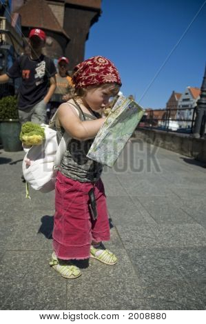 Little Girl With A City Map. Travel