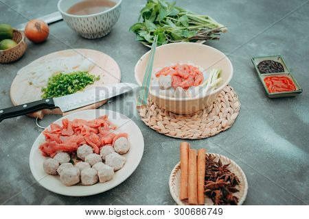 Traditional Vietnamese Soup Pho Bo With Herbs, Meat, Rice Noodles, Broth. Pho Bo In Bowl With Chopst