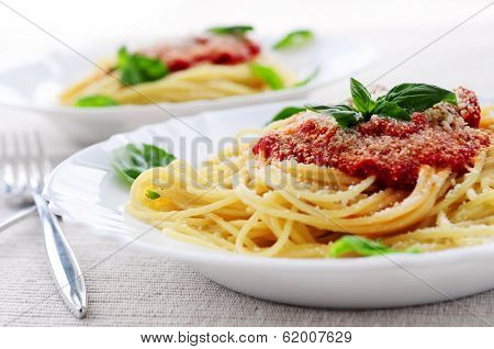 Pasta with tomato sauce basil and grated parmesan