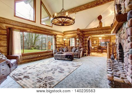 Bright Living Room Interior In American Log Cabin House.