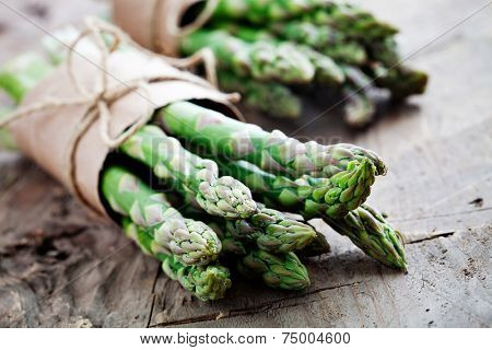 Bunch of fresh asparagus on wooden table