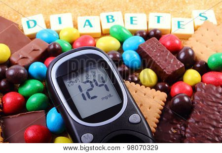 Glucometer, Sweets And Cane Brown Sugar With Word Diabetes, Unhealthy Food