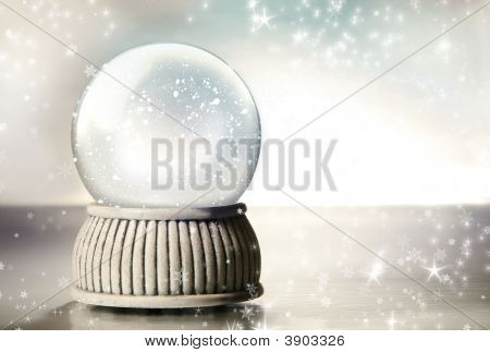 Snow Globe Against A Silver Background