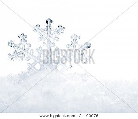 Snowflake in white snow. Isolated.