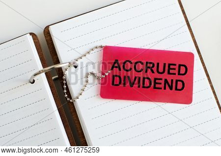 On The Business Card Is The Text Accrued Dividend