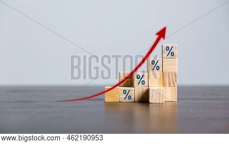 Closeup Wood Cubes With Percentage Symbol, Percent And Upwards Increasing Arrows On Wooden Cubes. Fi