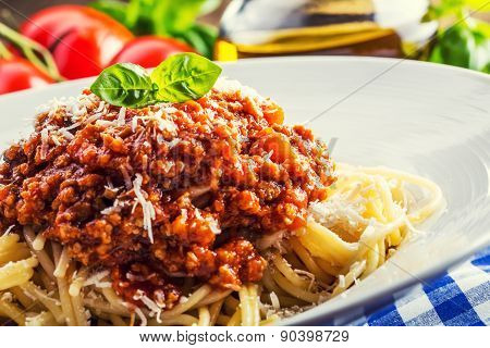 Spaghetti. Spaghetti bolognese and basil leaves.