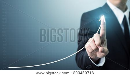 Businessman hand touching point graph growth or increase business chart Growing up revenue and development concept