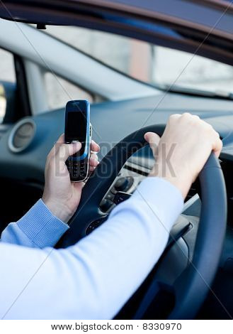 Close-up Of A Caucasian Man Sending A Message While Driving