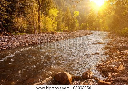 Mountain River At Sunset