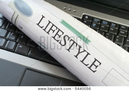 Lifestyle Section Of Newspaper On Laptop