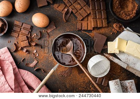 Top View Of The Process Of Cooking Chocolate Bakery Pastry With Melting Chocolate. Ingredients For C