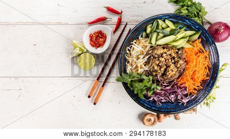 Top view composition of Bun bo nam bo vietnamese food in bowl, free space for text