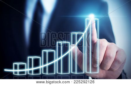 Business development to success and growing annual revenue growth concept, Businessman pointing arrow graph corporate future growth plan