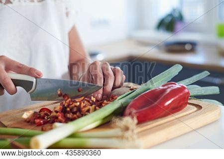 Woman cooking food in kitchen.woman hands cooking food in kitchen. Cooking food lifestyle. Cooking food. woman cooking food at home. Lifestyles. Healthy food.Food cooking woman lifestyle. Food