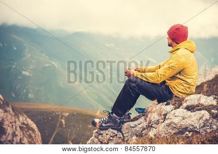 Man Traveler relaxing alone in Mountains Travel Lifestyle