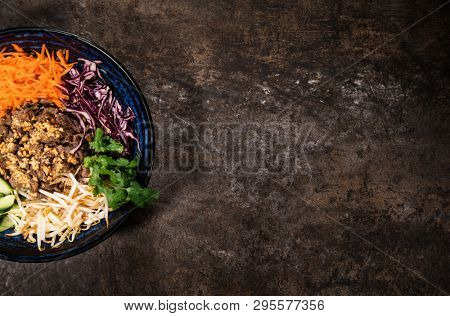 Bun bo nam bo asian food background with various ingredients on rustic stone background , top view. Vietnam or Thai cuisine.