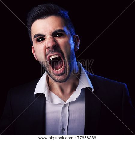 Scary Man With Black Eyes And Fangs