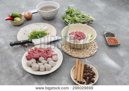 Traditional Vietnamese Soup Pho Bo With Herbs, Meat, Rice Noodles, Broth. Pho Bo In Bowl With Chopst