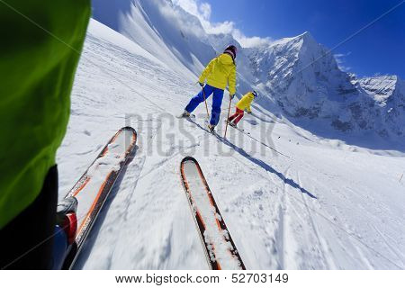 Skiing, skiers on ski run - child skiing downhill, ski lesson